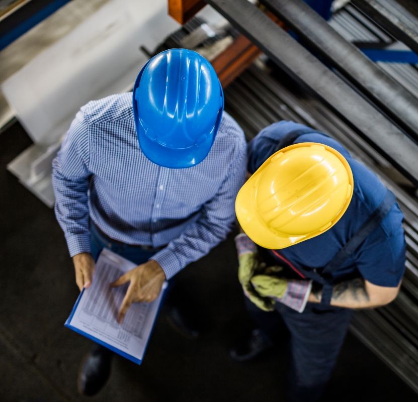 two construction workers planning